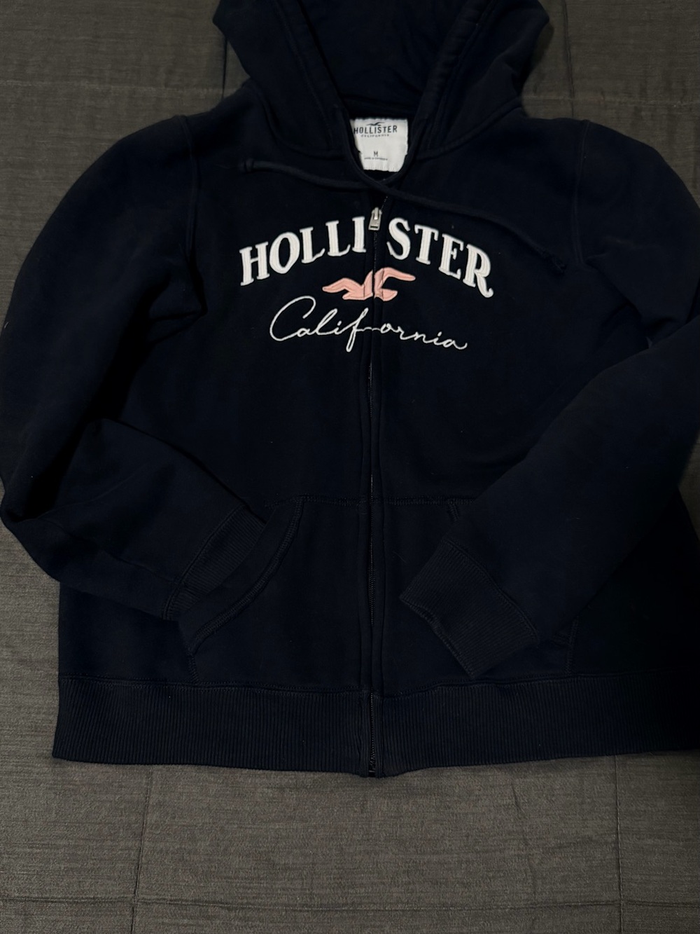 Hollister Navy Zip Hoodie with Pink Logo and White Script